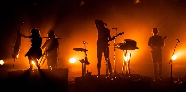 Stage Backlighting Effects Stage backlighting setup, creating dramatic silhouettes of performers with warm amber tones